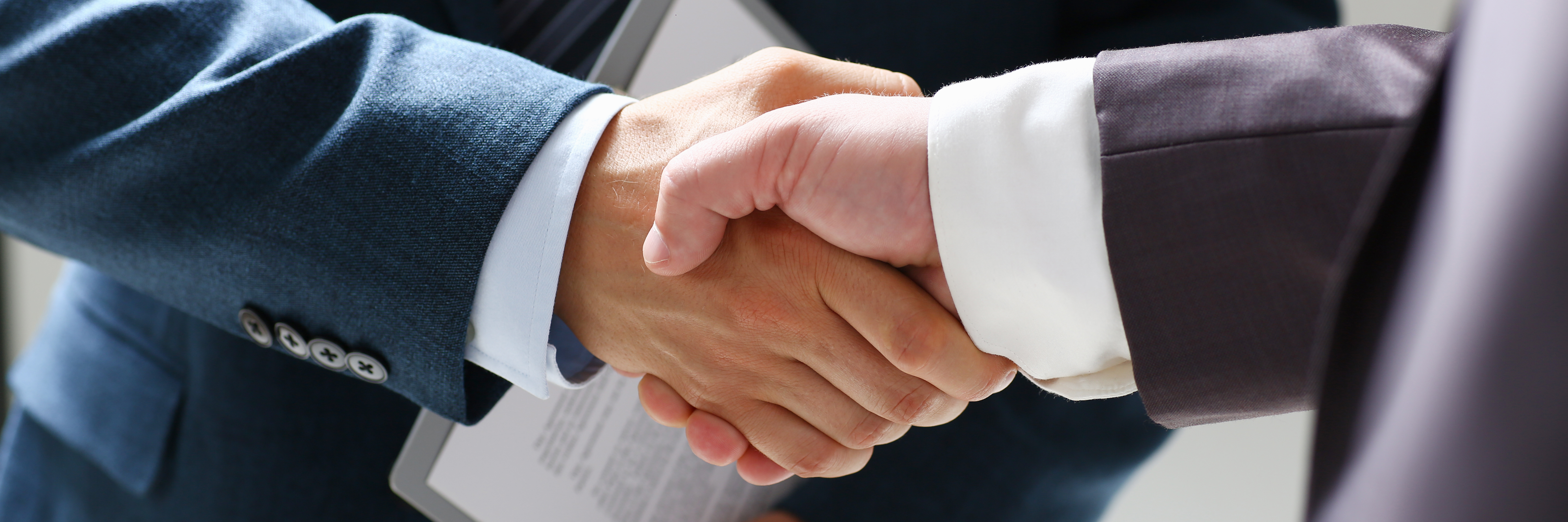 Man,In,Suit,Shake,Hand,As,Hello,In,Office,Closeup. Man,In,Suit,Shake,Hand,As,Hello,In,Office,Closeup.